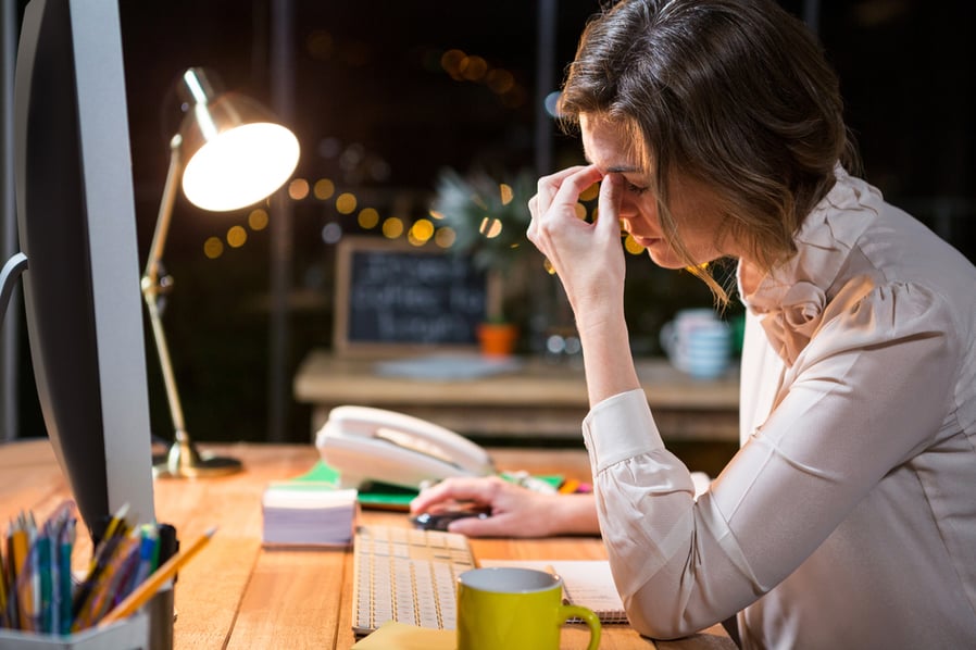 woman-stressed-sitting-at-desk