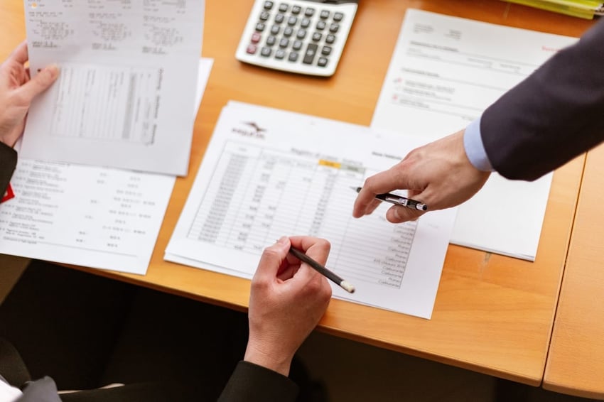 people-pointing-at-paperwork