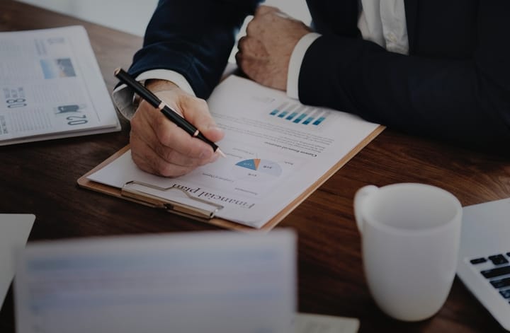 man-writing-financial-plan