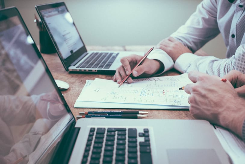 two-people-working-on-financial-report